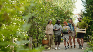 Group of diverse people walking a forested path.